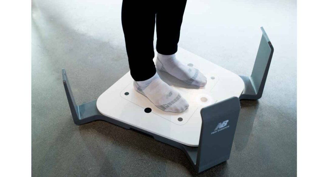 Customer standing on the Volumental scanner to get their feet scanned